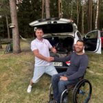 Handing off the handcycle to his father